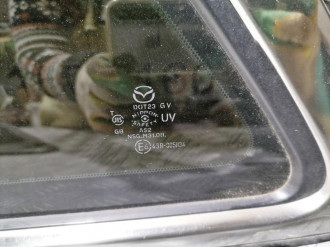 Стекло кузовное глухое заднее левое Mazda Cx7 2007-2012