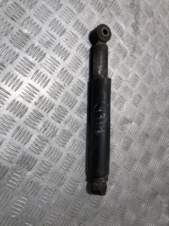 Амортизатор задний левый Nissan Navara d40