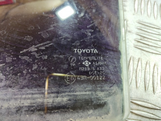 Стекло двери задней левой Toyota Corolla e120